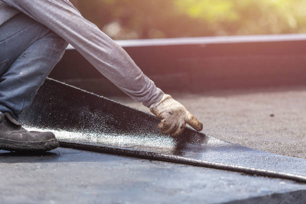 Professional Basement Waterproofing technician working in Sayville, NY